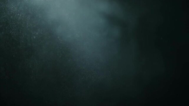 Close-up of fine particles or dust floating in dark air