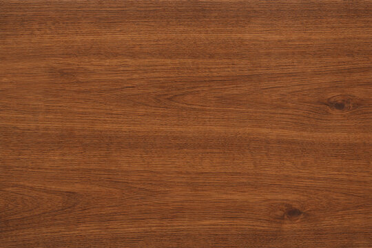 Natural mahogany wood texture with rich reddish-brown tones, fine grain, and subtle organic variations. High-resolution seamless surface, ideal for furniture, flooring, cabinetry, interiors, and backg