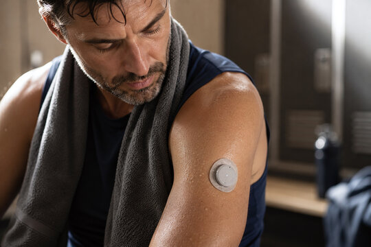 Athlete Wearing Smart Health Sensor Patch After Workout