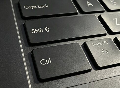 Macro Close Up of Black Laptop Keyboard Showing Shift Ctrl and Caps Lock Keys