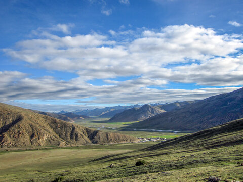 A beautiful landscape with rolling hills and a clear blue sky