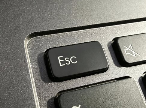 Macro Close Up of Escape Esc Key on Modern Black Laptop Keyboard