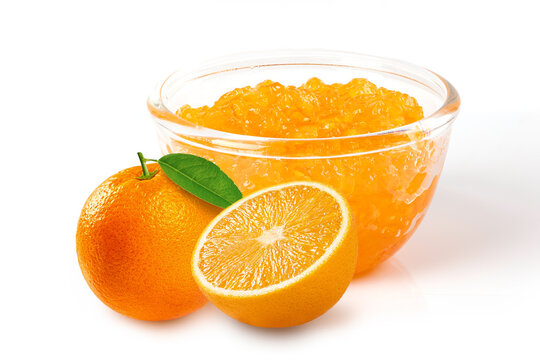Delicious bowl of orange jam with  fresh whole orange and juicy half slice, isolated on white. for breakfast menus, bakery labels, and healthy food advertising.