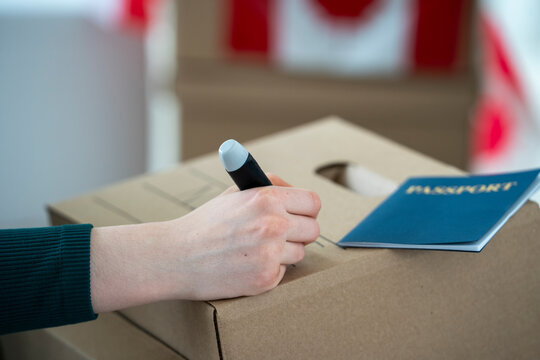 Packing for International Relocation with Passport and Moving Box