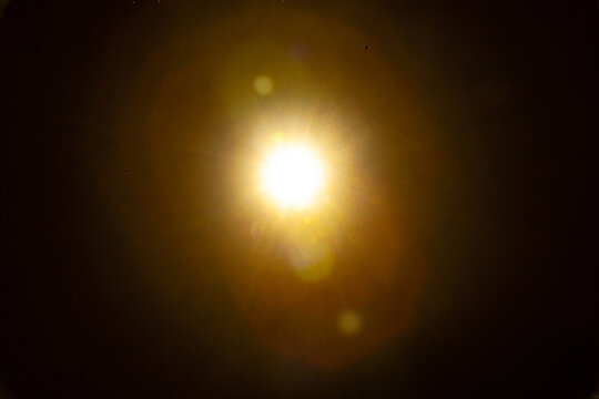 Sun flare on the black background