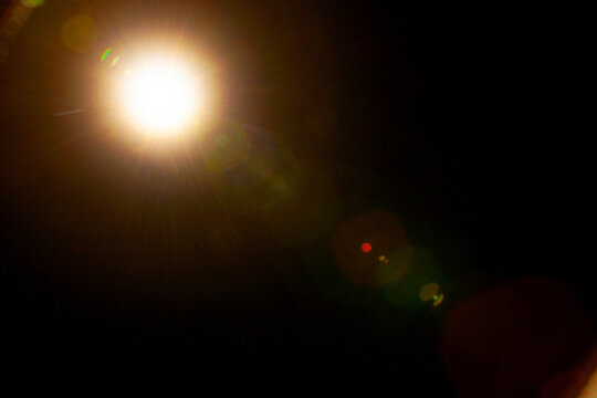 Sun flare on the black background