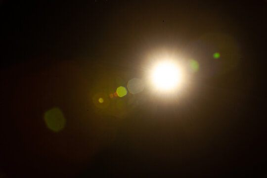 Sun flare on the black background