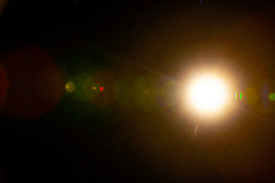 Sun flare on the black background