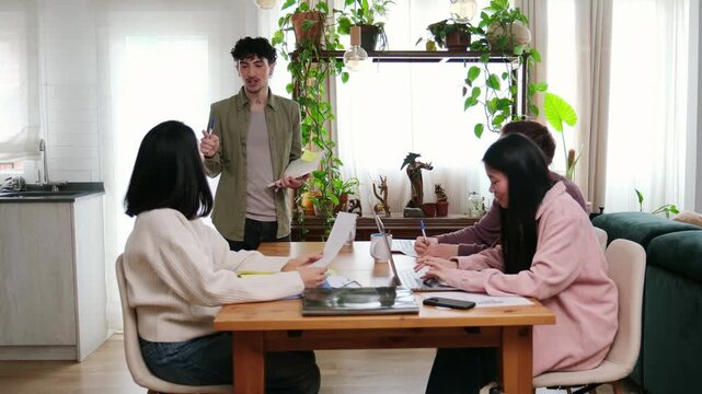 Group of diverse colleagues collaborating on a new project in a bright, modern office space