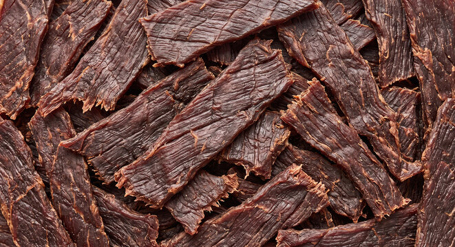 Rough Dark Beef Jerky Strips Showing a Dense Dehydrated Meat Texture