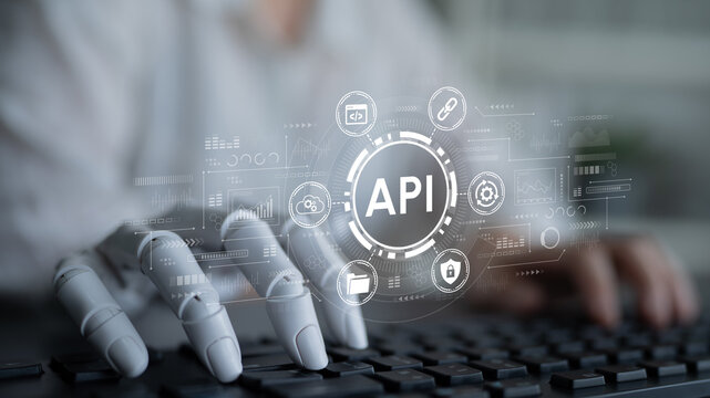 Futuristic Digital Interface with Robotic Hand Interacting with API Symbols Representing Technology and Software Development in Modern Workspace. Entropy.
