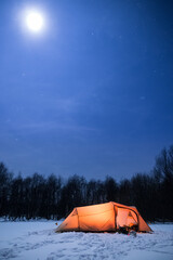 Illuminated tent under a clear sky in winter © Alexander Erdbeer