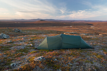 Tent on a little hill in northern Finland during sunset © Alexander Erdbeer