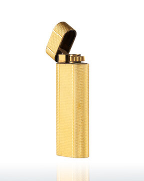 Luxurious vintage lighter featuring a precious yellow gold plating with a textured diamond pattern. Photographed on a white background.