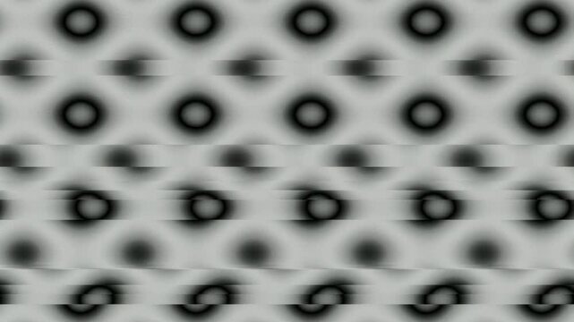 Abstract background with blurred circular patterns in shades of grey and white.