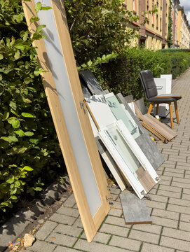 Discarded Furniture on the Street Ready for Bulky Waste Collection and Recycling	Vertical