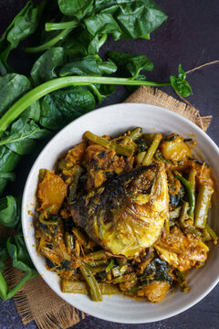 Ilish Macher Matha Diye Pui Shaker Ghonto Traditional Bengali Hilsa Fish Head with Malabar Spinach Curry Served in a Bowl
