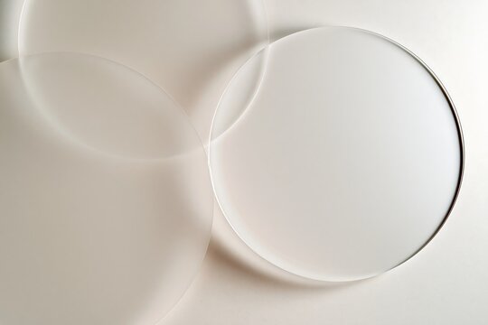 Abstract minimal background with clear glass circle shapes on white wall
