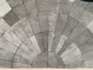 Obraz premium Top view of semi circle paved stone pavement pattern on ground