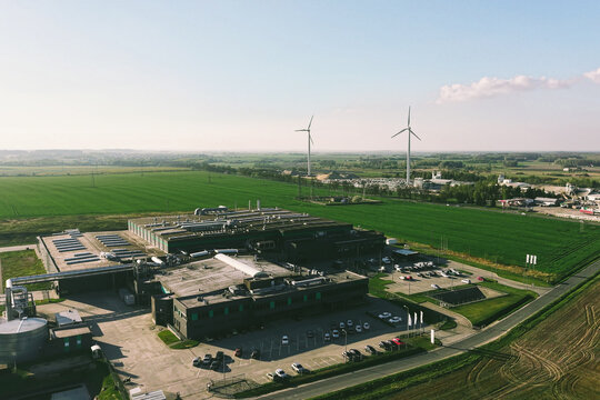 Modern AI data centre in green rural landscape
