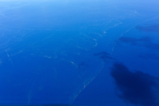 Whitsundays ocean water surface with sea sawdust patterns