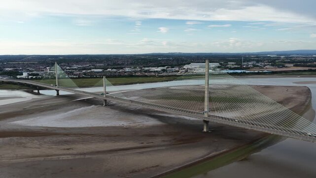 Aerial view of the mersey gateway bridge at low tide