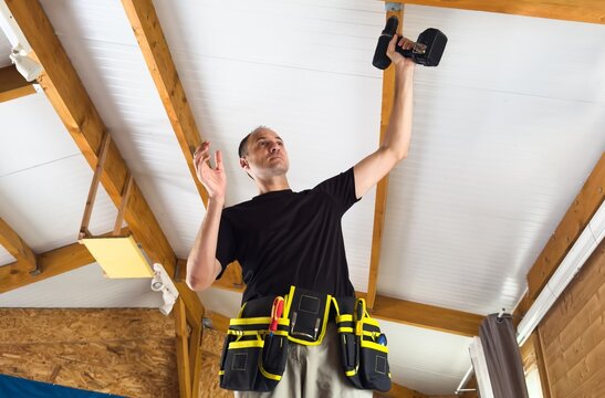 Construction worker installation ceiling work