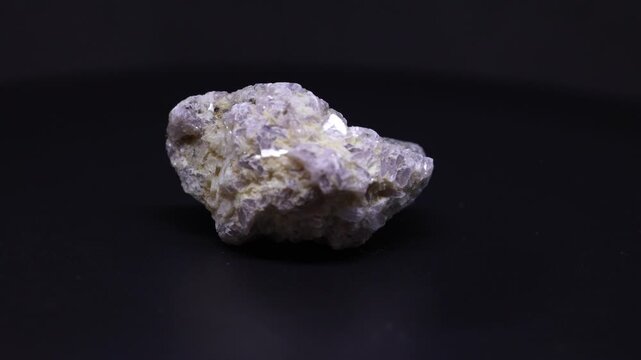 lepidolite mineral from Brazil with black background