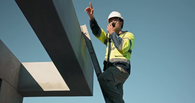 Ladder, thumbs up and construction engineer with radio on roof, inspection feedback or space below. Communication, talk or man outdoor for building check approval, structure integrity or site safety