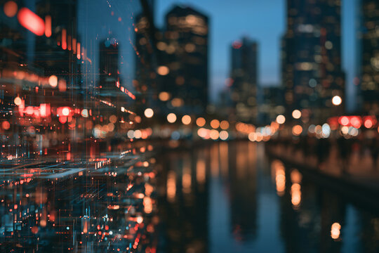 Vibrant city nightscape with captivating blurred lights and colorful reflections on water, symbolizing modern urban energy and dynamic flow