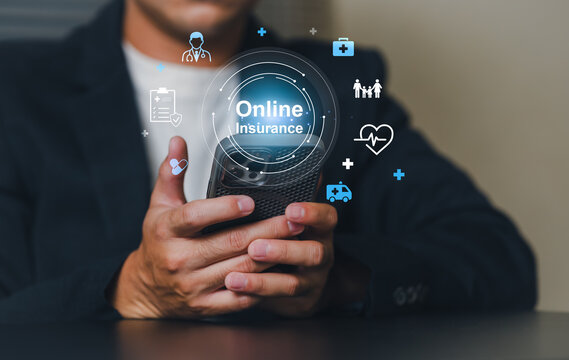 A professional in a suit interacts with a digital interface on a smartphone displaying online insurance icons and healthcare symbols, showcasing digital health and insurance services.