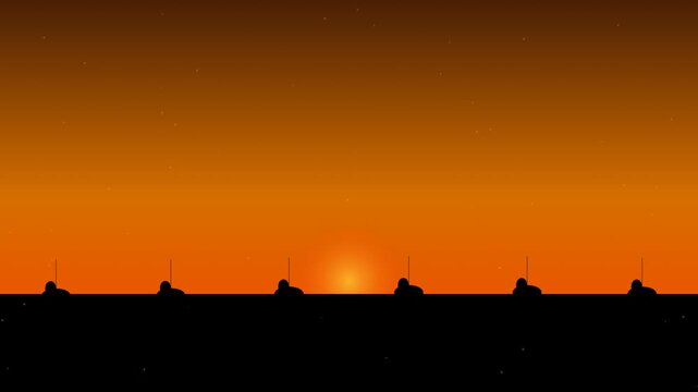 Silhouette of soldiers standing in a row against a bright orange sunset sky 4K Motion Video