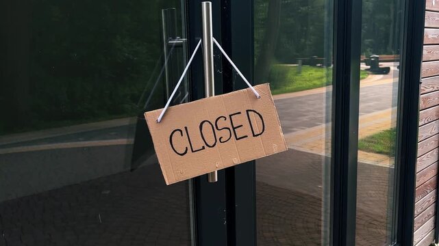 CLOSED sign on private shop window. Small local retail business closes because of financial and economic crisis. Entrepreneurs faces market changes