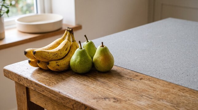 Ripe bananas beside firm pears for a food waste campaign