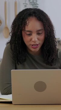 Vertical HD video of young student asking questions during online class. Female college student speaking with professor on video call while studying from home. Online education and distance learning