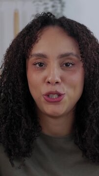 POV of young student talking during online class. Female college African American student speaking with her professor during video call while studying from home. Vertical video
