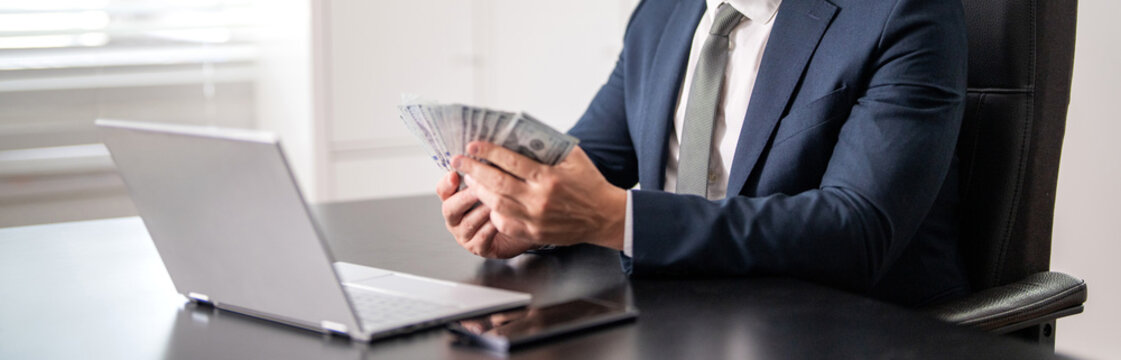 Business success. Businessman count money at office desk. Business man freelancer count dollar at office. Ambitious entrepreneur count money. Successful invest money in business, money cash
