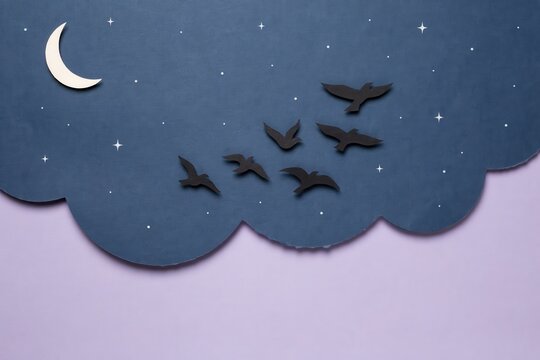 Artistic paper-cut illustration of a night sky scene, featuring a peaceful crescent moon and twinkling stars above a cloud, with birds flying freely, symbolizing tranquility and imagination