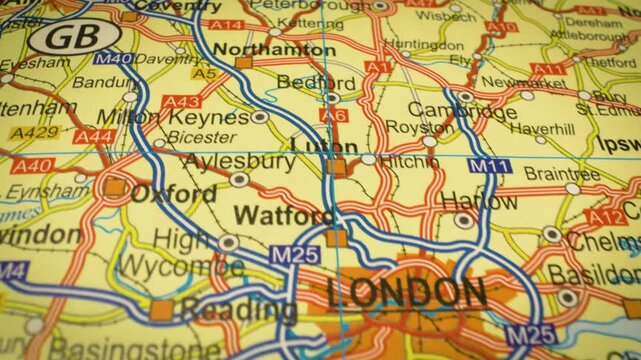Gliding camera view following major road network map leading to London