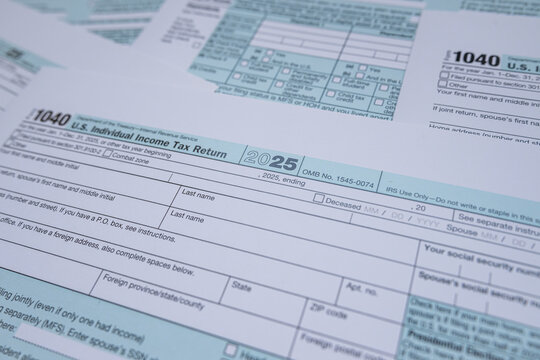 US Individual Income Tax Return Form 1040 Blank Documents for Annual Filing and Accounting Concept