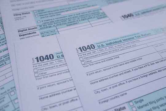 US Individual Income Tax Return Form 1040 Blank Documents for Annual Filing and Accounting Concept