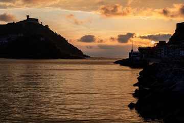 Fototapeta premium Golden Sunset over La Concha Bay and Beach in San Sebastian, Basque Country, Spain