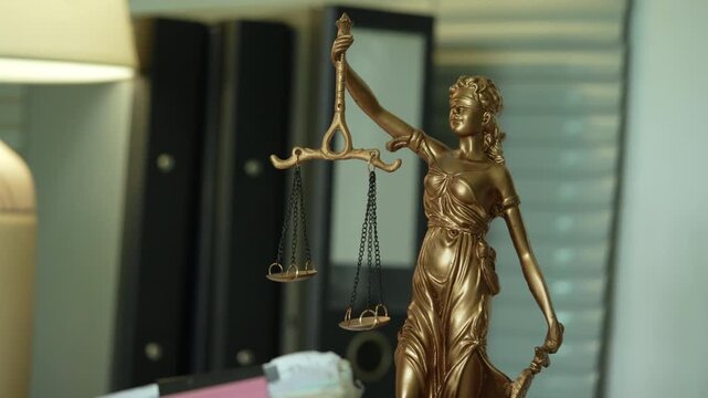 Lady Justice Statue with Scales in Professional Law Office
