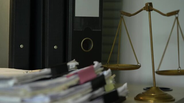 Legal Documents and Scales of Justice in Law Office Workplace