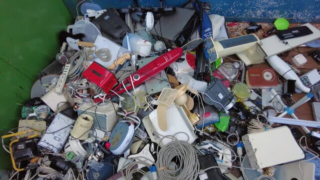 Europe, Italy, Milan: municipal sorted waste collection in Recycling and Waste Drop-off Center&mdash;RAE and household waste (glass, plastic, appliances, iron, paper, wood) separated for recycling at an Ams