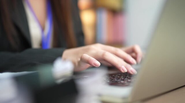 Female Office Worker Using Laptop for Digital Business Tasks