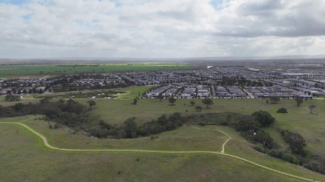 An aerial view of Toolern Creek&nbsp;and the residential suburb of Weir Views in Melbourne Australia, featuring walking trails and expanding suburban housing estates