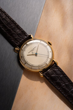 Vacheron Constantin hand-wound watch, reference P454 5B, 18kt yellow gold case with two-tone dial and leather strap. Milan, Italy, August 21, 2026