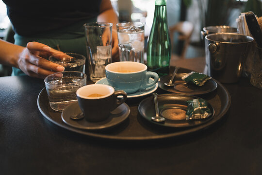 Coffee drinks prepared for cafe customers
