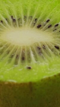 Macro close-up of a fresh green kiwi fruit slice